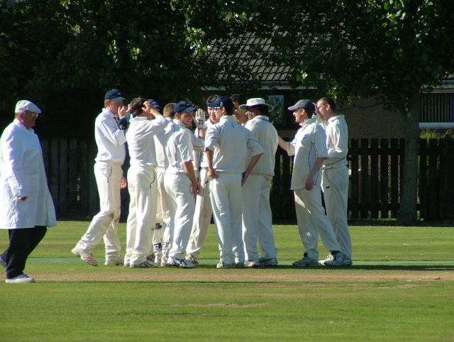 Smiles all round to celebrate a wicket. Can someone please tell Andy Smith to tuck in his shirt!