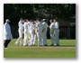 Smiles all round to celebrate a wicket. Can someone please tell Andy Smith to tuck in his shirt!